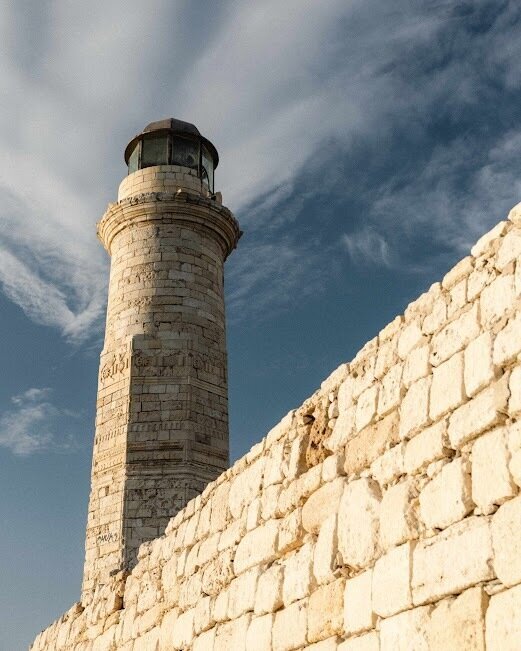 Historic Egyptian Lighthouse at Rethymno’s Venetian Harbour, showcasing the city’s character for travellers comparing Rethymno or Chania.