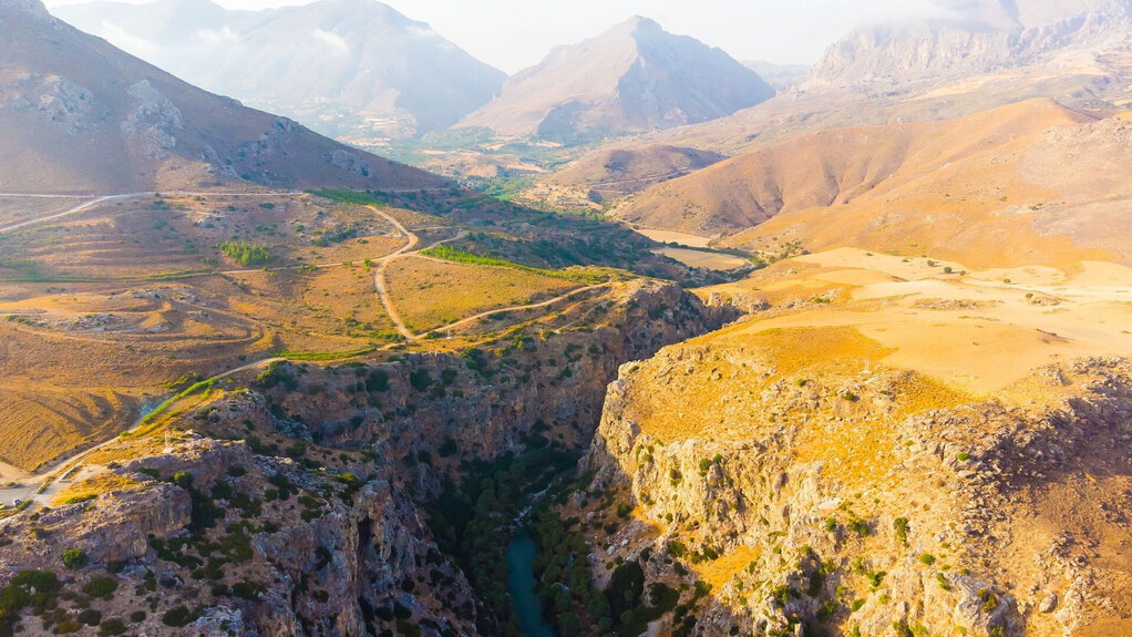 Aerial view of mountainous plateau in Crete, connecting you to all the places to see and things to do near Rethymno.